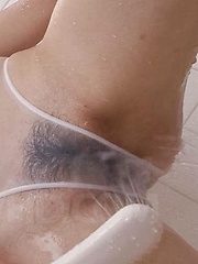 Noriko Kago plays with shower on peach over see through shower